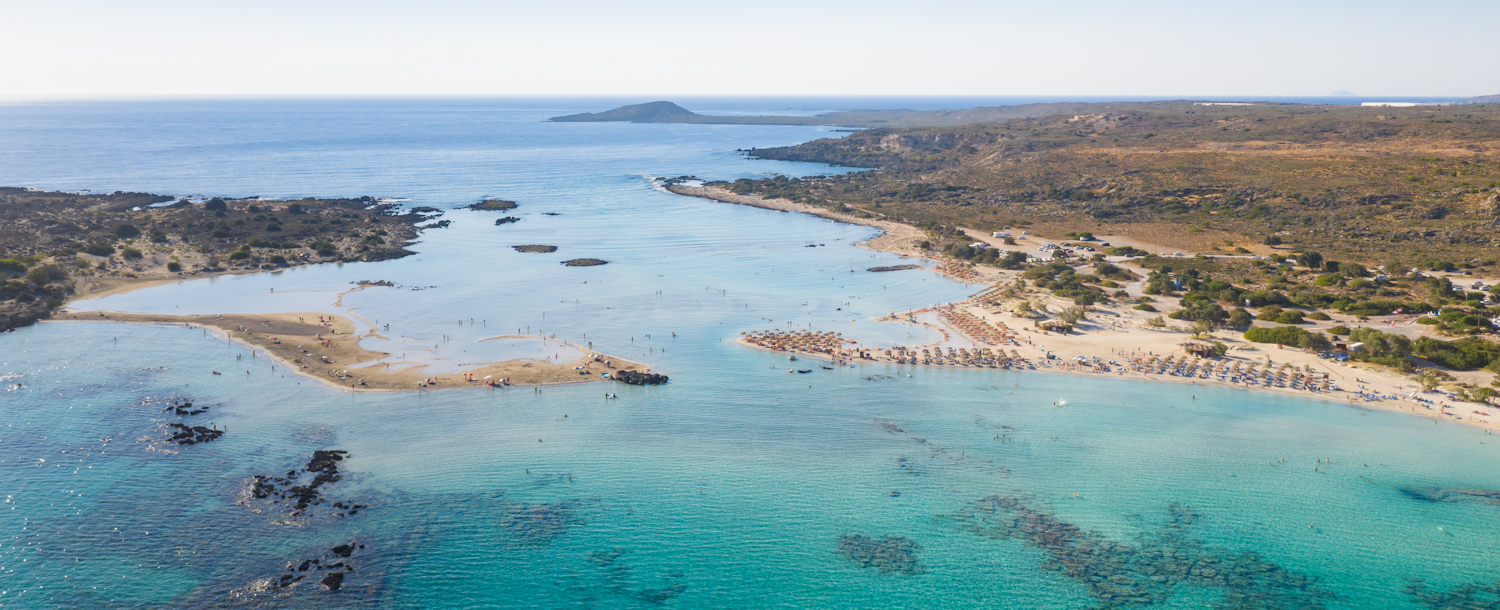 Elafonisi (Greek: Ελαφονήσι "Deer island") near the southwestern corner of Crete. You can walk to the island through the shallow water. It is known for its pink sand, created by deposits of pigmented microorganisms in the seaweed.