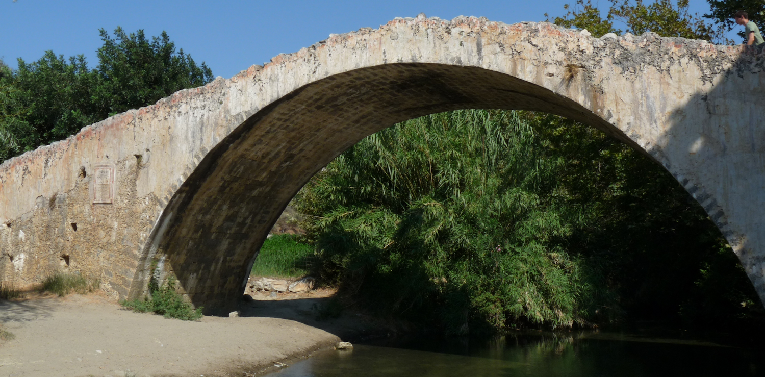 Old bridge crossing river at the Kourtaliotiko canyon in Crete