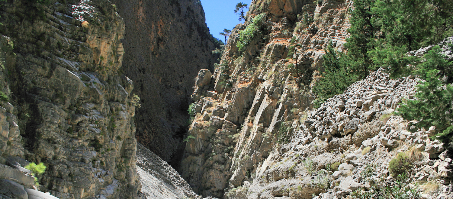The Samariá Gorge is a National Park and a World's Biosphere Reserve. The gorge is 16 km long, starting at an altitude of 1.250 m and ending at the shores of the Libyan Sea in Agia Roumeli.